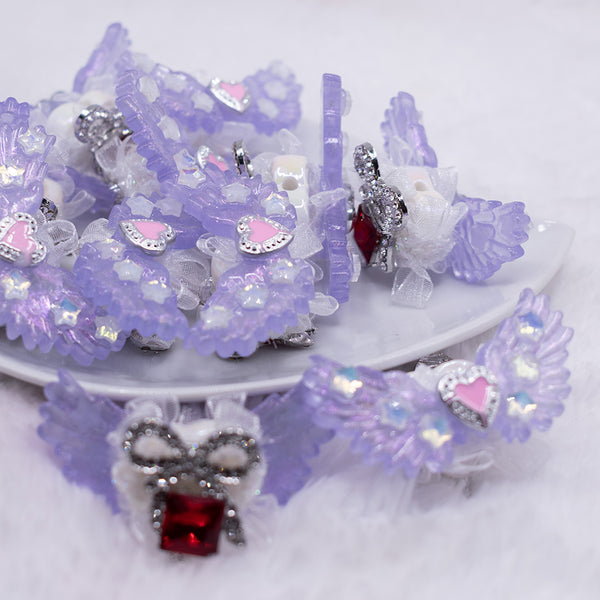 front view of a pile of 26mm Purple Double sided wing bead