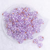 top view of a pile of 16mm Purple with Flower luxury acrylic beads