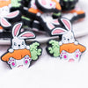 front view of a pile of Rabbit with Carrot Silicone Focal Bead Accessory