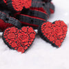 close up view of a pile of Red Roses Heart Silicone Focal Bead Accessory