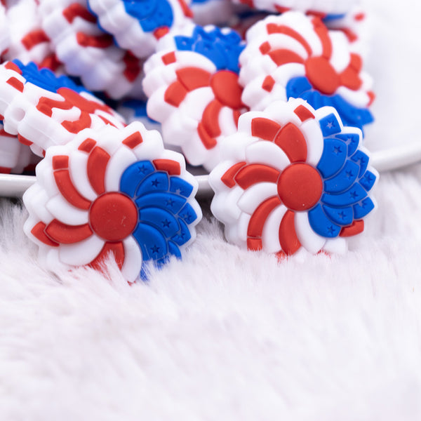 close up view of a pile of Red, White and Blue Flower Silicone Focal Bead Accessory
