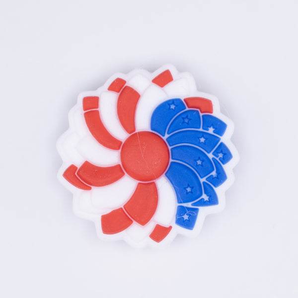 top view of a pile of Red, White and Blue Flower Silicone Focal Bead Accessory