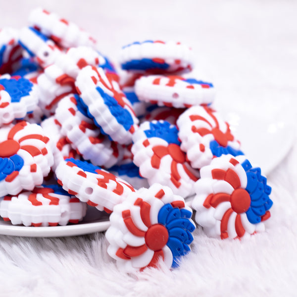 front view of a pile of Red, White and Blue Flower Silicone Focal Bead Accessory