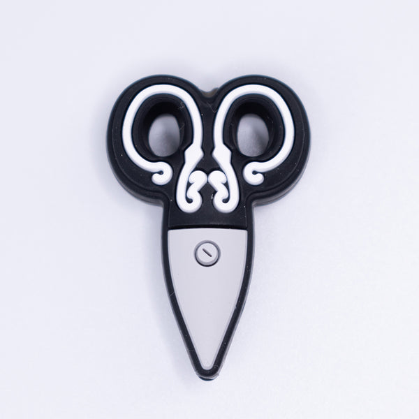 top view of a pile of Scissors Silicone Focal Bead Accessory