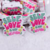 close up view of a pile of Self Love Silicone Focal Bead Accessory