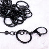 close up view of a pile of Shiny Black Beadable Keychain - 1 & 5 Count