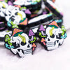front view of a pile of Skull with Mushrooms Silicone Focal Bead Accessory