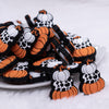 front view of a pile of Stacked Pumpkins Silicone Focal Bead Accessory