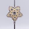close up front view of a pile of 28mm Gold Star with rhinestone bead