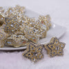 front view of a pile of 28mm Gold Star with rhinestone bead
