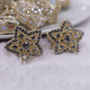 close up view of a pile of 28mm Gold Star with rhinestone bead