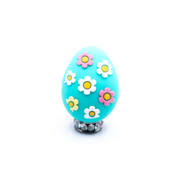 top view of a pile of 3D Teal Egg with Flowers Silicone Focal Bead Accessory