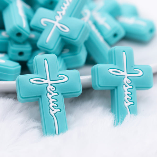 macro view of Teal Cross Silicone Focal Bead Accessory