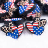 close up view of a pile of Patriotic Hearts with Leopard print Silicone Focal Bead Accessory