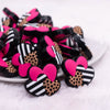 front view of a pile of Triple hearts with leopard print Silicone Focal Bead Accessory