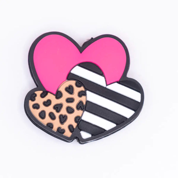 top view of a pile of Triple hearts with leopard print Silicone Focal Bead Accessory