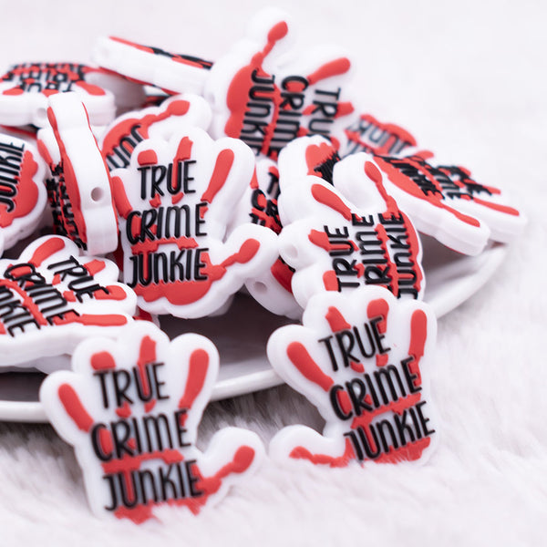 front view of True Crime Junkie Silicone Focal Bead Accessory