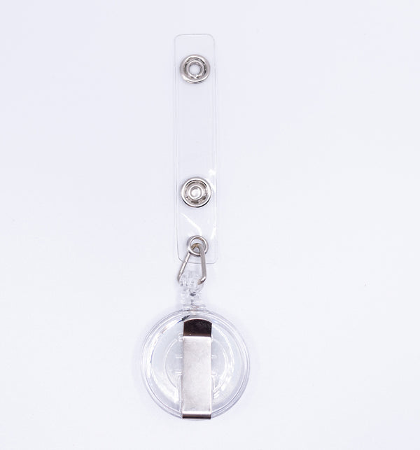 top view of a pile of White Badge Reel