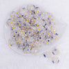 top view of a pile of 16mm White with Blue Flower luxury acrylic beads
