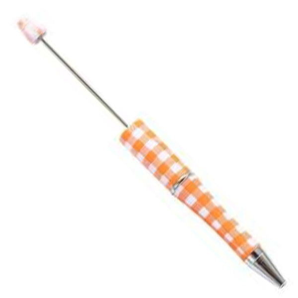 top view of a orange and white plaid DIY Plastic Beadable Pens - The Printed Collection