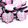 Close up view of a pile of Hugs and Kisses Heart Silicone Focal Bead Accessory