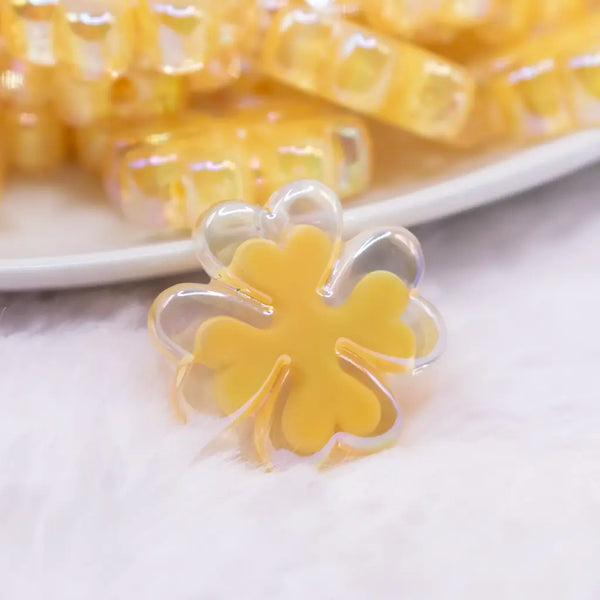 close up view of a pile of 25mm Yellow Clover acrylic bead