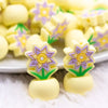 macro view of a pile of Yellow Flower with Pot Silicone Focal Bead Accessory