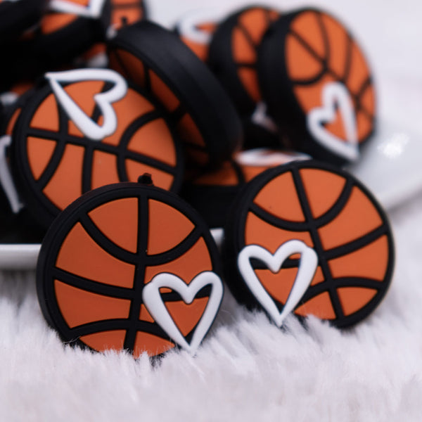 close up view of a pile of Basketball Silicone Focal Bead Accessory
