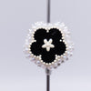 close up front view of a pile of 27mm Black flower with rhinestone and pearl surround acrylic bead