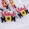 macro view of a pile of Blessed Mom Silicone Focal Bead Accessory