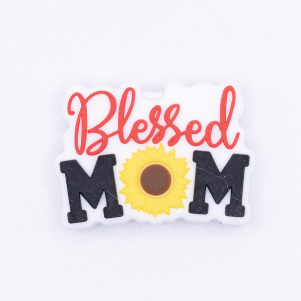 top view of a pile of Blessed Mom Silicone Focal Bead Accessory