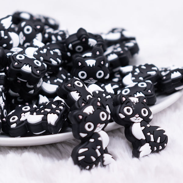 front view of a pile of Cat Silicone Focal Bead Accessory