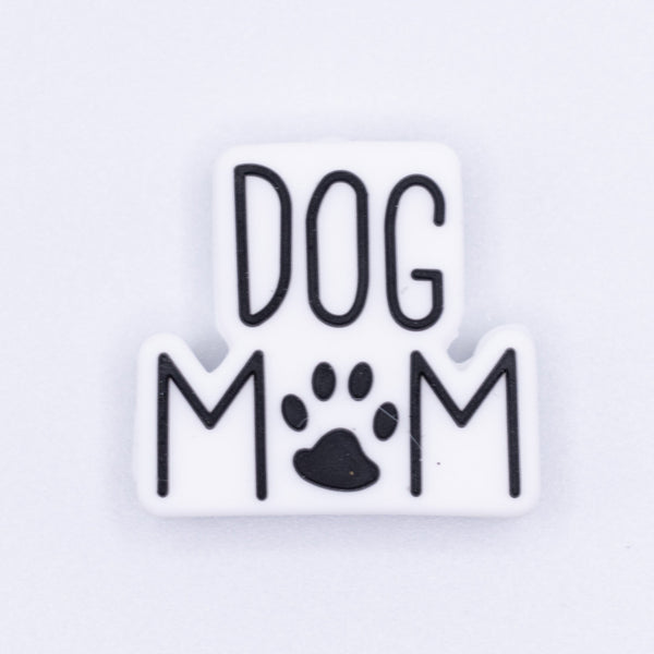 top view of a pile of Dog Mom with paw print Silicone Focal Bead Accessory