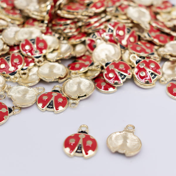 front view of a pile of Red Ladybug charm with gold plating 18x20mm