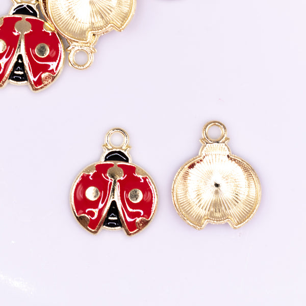 close up view of a pile of Red Ladybug charm with gold plating 18x20mm