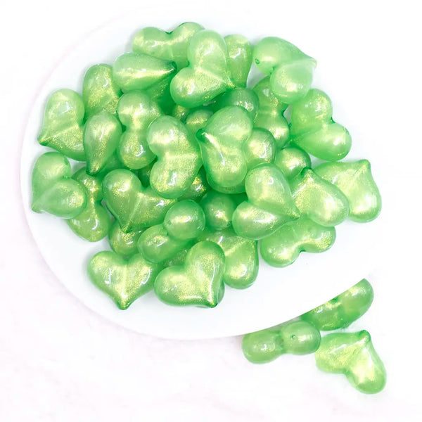 top view of a pile of 27mm Green Glitter Pearl Heart Acrylic Bubblegum Beads