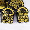 front view of a pile of Little Miss Sunshine Silicone Focal Bead Accessory