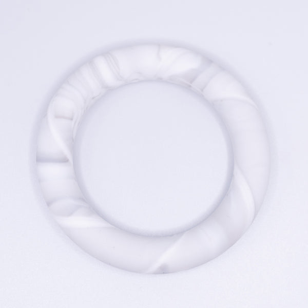 view of a marble white of 65mm Round Ring Silicone Focal Beads Accessory