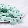 front view of a pile of Mint Green Ghost Silicone Focal Bead Accessory