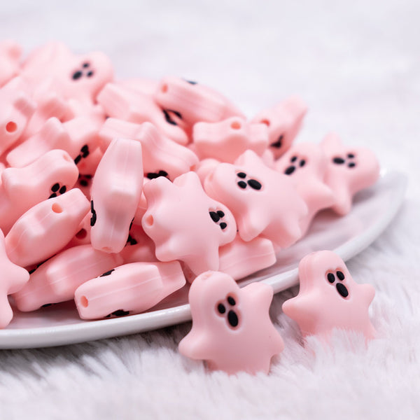 close up view of a pile of Pink Ghost Silicone Focal Bead Accessory