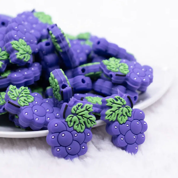 front view of a pile of Purple Grape Silicone Focal Bead Accessory