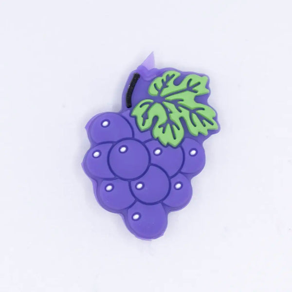 top view of a pile of Purple Grape Silicone Focal Bead Accessory