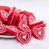 front view of a pile of Red Cupid Heart Silicone Focal Bead Accessory