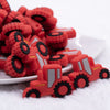 close up view of a pile of Red Tractor Silicone Focal Bead Accessory