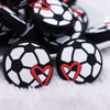 front view of a pile of Soccer Silicone Focal Bead Accessory