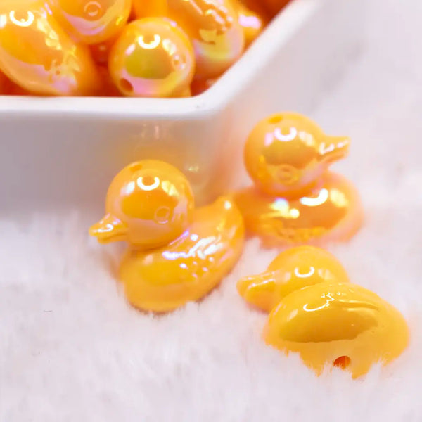 close up view of a pile of Yellow Ducky acrylic focal bead