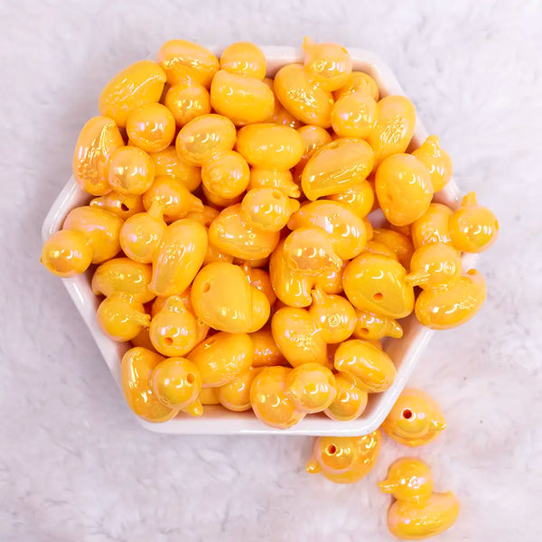 top view of a pile of Yellow Ducky acrylic focal bead