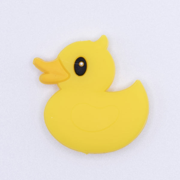 top view of a pile of Yellow Ducky Silicone Focal Bead Accessory