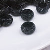 close up view of a pile of 12mm Black Resin Rhinestone Rondelle Spacer Beads - Set of 10