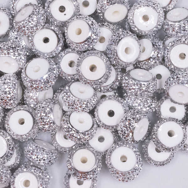 Top view of a pile of 12mm White Resin with Silver Rhinestone Rondelle Spacer Beads - Set of 10